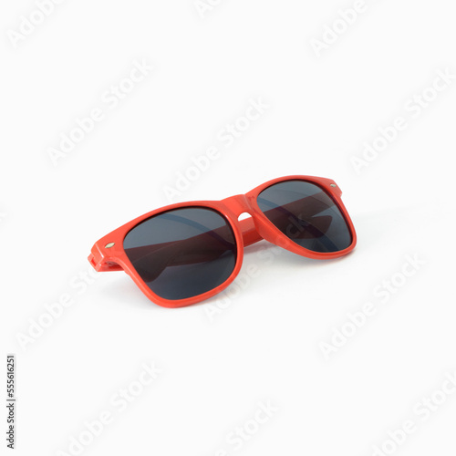 Red sunglasses on white background. Square format