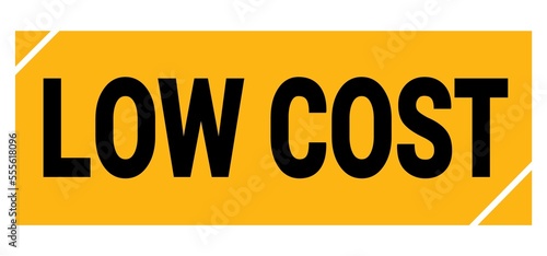 LOW COST text on yellow-black grungy stamp sign.