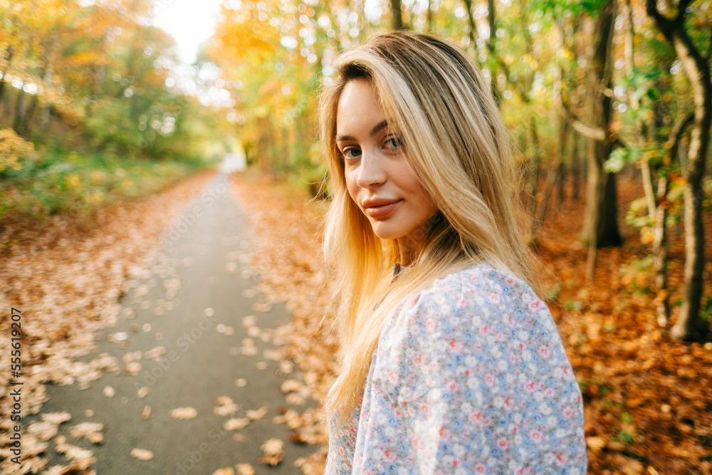 Portrait of attractive caucasian woman posing in the autumn park. Portrait of attractive caucasian woman posing in the autumn park.