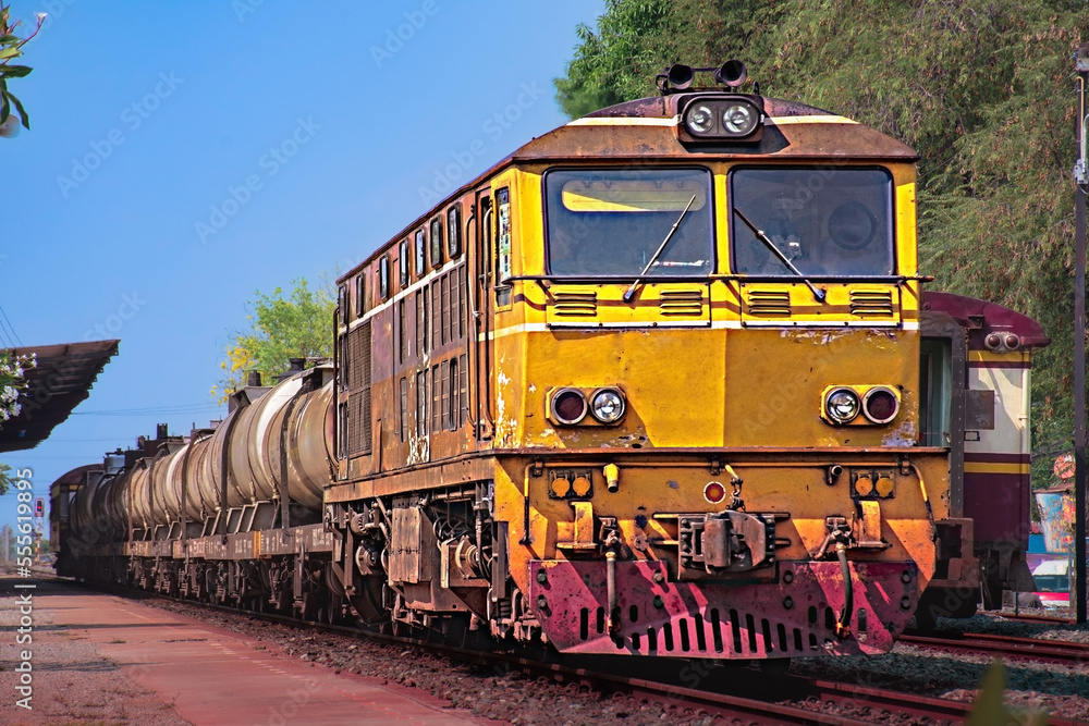 Tanker-freight train by diesel locomotive on the railway. Tanker-freight train by diesel locomotive on the railway.