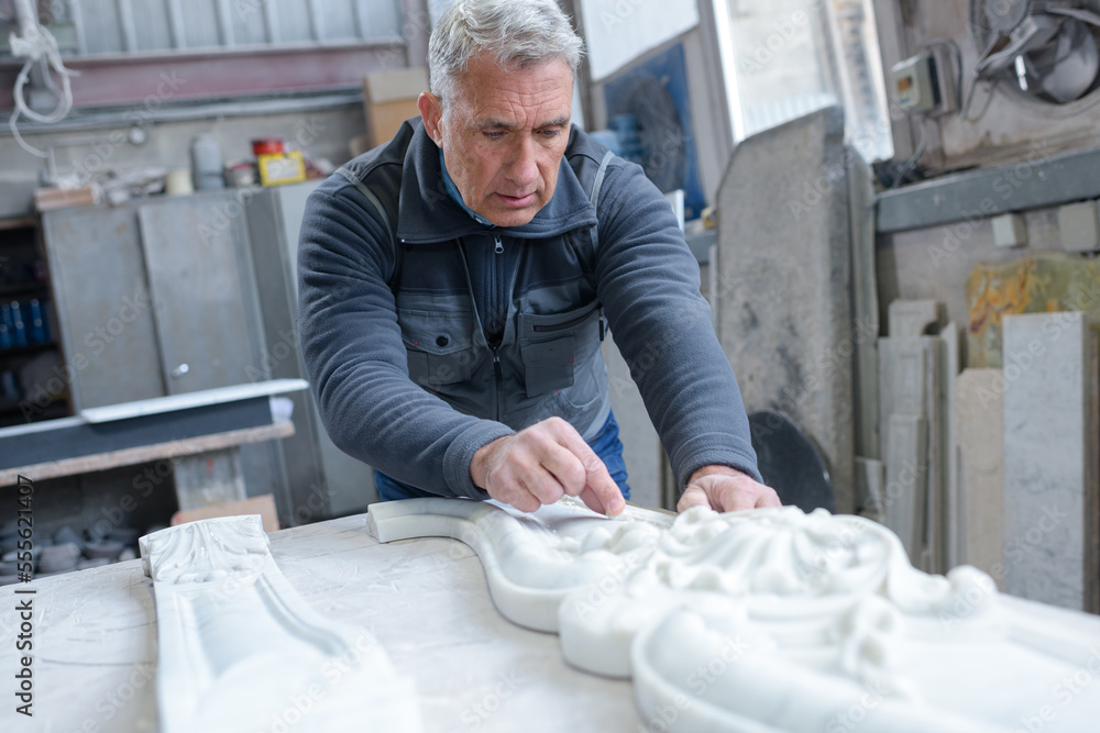senior stonecutter in his workshop senior stonecutter in his workshop