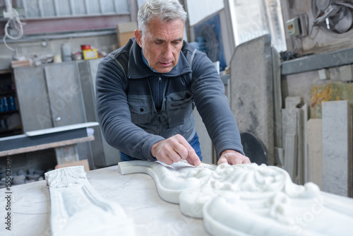 senior stonecutter in his workshop