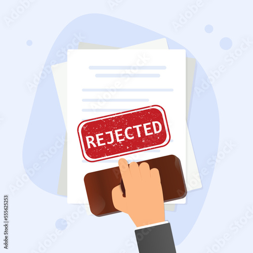 Hand holding rubber stamp. Notary stamping rejected word on a document
