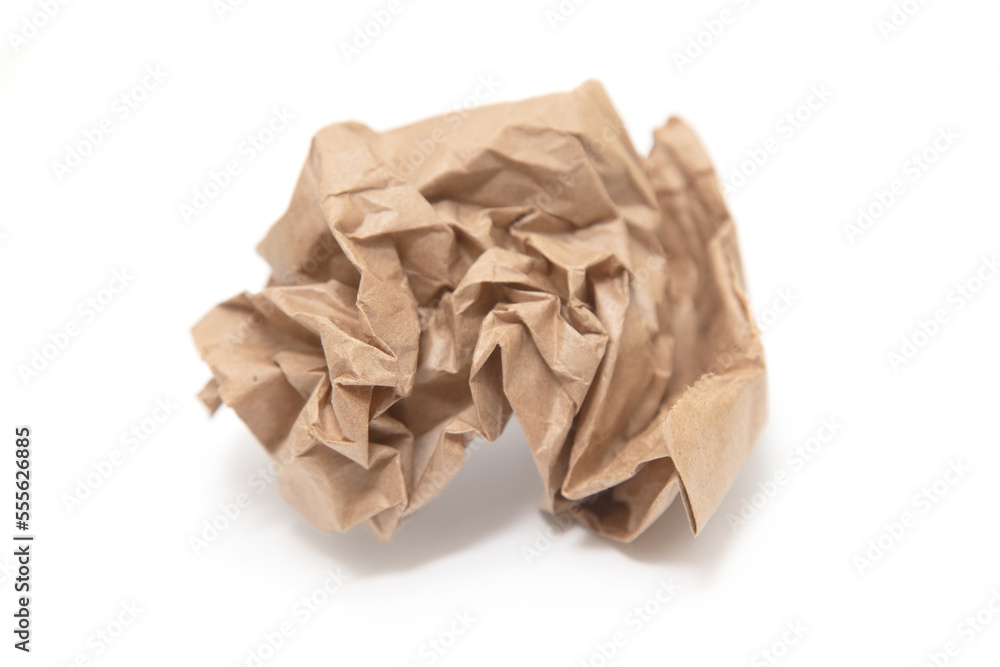 Crumpled brown paper bag on a white background. Crumpled brown paper bag on a white background.