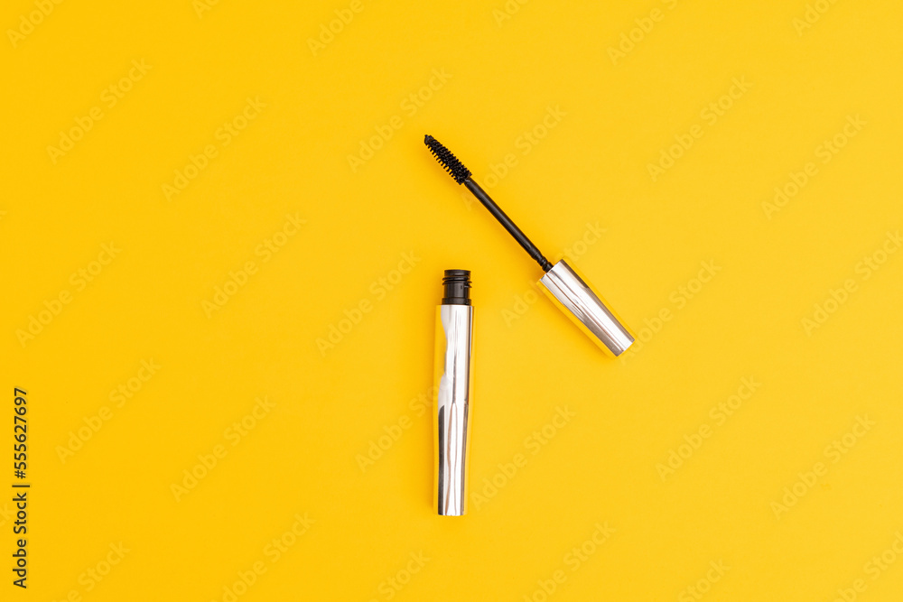 Silver mascara with yellow background Silver mascara with yellow background