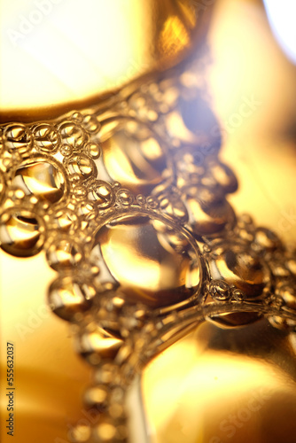Macro shot of golden liquid bubbles 
