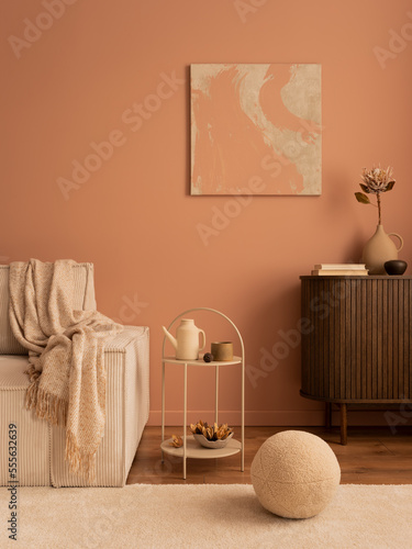 Creative composition of living room interior with mock up poster frame, wooden sideboard, modular beige sofa, beige coffee table, rug, pink wall and personal accessories. Home decor. Template. © FollowTheFlow