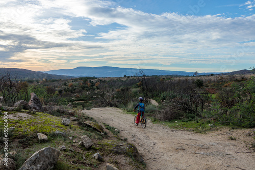 Child Cycling Through the Stunning Sierra Estrella Mountain Range in Portugal
