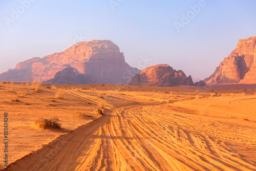 Fototapeta Naklejka Na Ścianę i Meble -  Jordan, Wadi Rum road Jeep safari in desert, off-road car trace on dune sand and beautiful rocks landscape