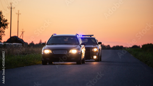 Highway Traffic Patrol Car Pull over, routine Check, Road Inspection Stop. Professional Black Female Police Officer Approaches Vehicle, Asks Driver License and Registration. Cinematic © Gorodenkoff