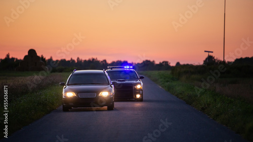 Fotografía Speeding Driver Gets Pulled Over By Police Patrolling Car