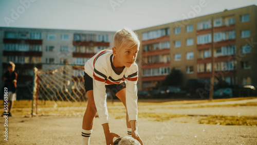 Φωτογραφία Young Friends Playing Soccer Outside in the Neighborhood