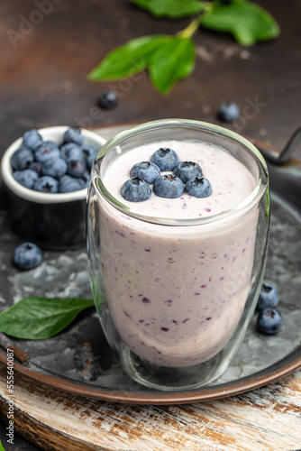blueberry smoothie in glass, Homemade berry smoothie. Healthy eating. Diet food yogurt on a dark background, place for text, top view