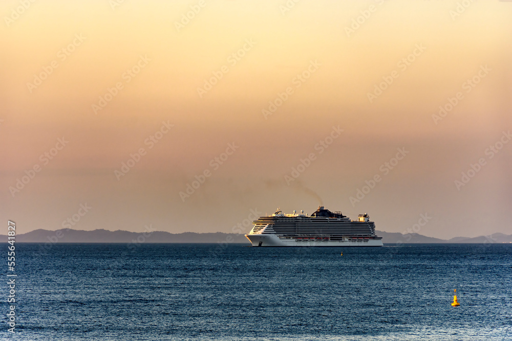 Luxury cruise ship arriving in the city of Salvador in Bahia during summer sunset