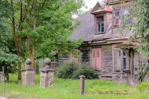 Fototapeta Naklejka Na Ścianę i Meble -  Old, abandoned, wared down wooden house exterior in a small European village