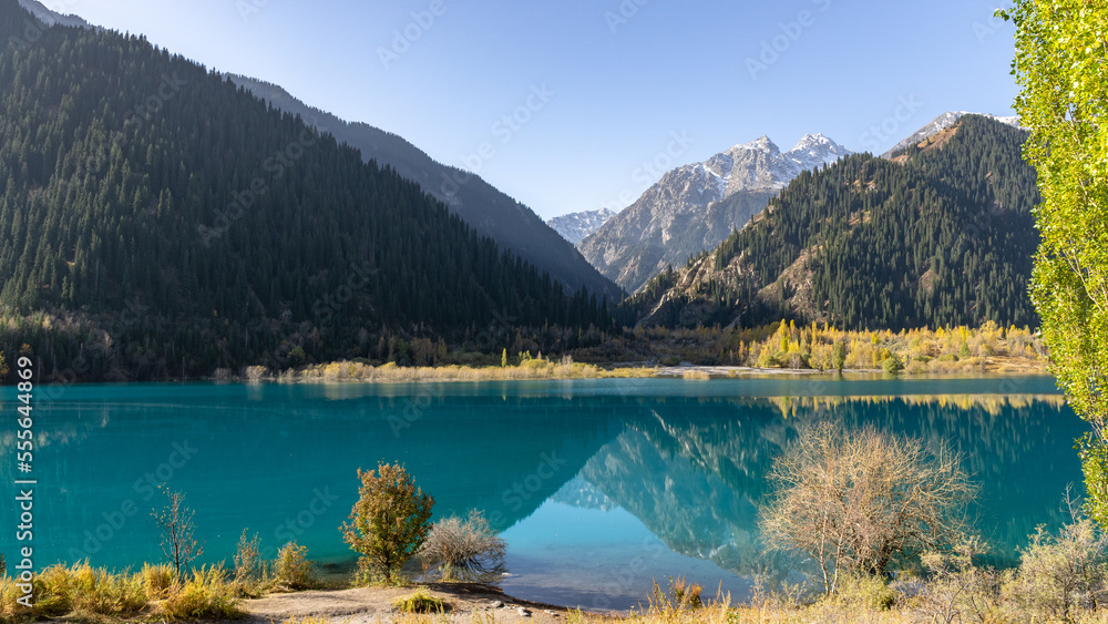 golden autumn in a mountain gorge. beautiful mountain lake golden autumn in a mountain gorge. beautiful mountain lake