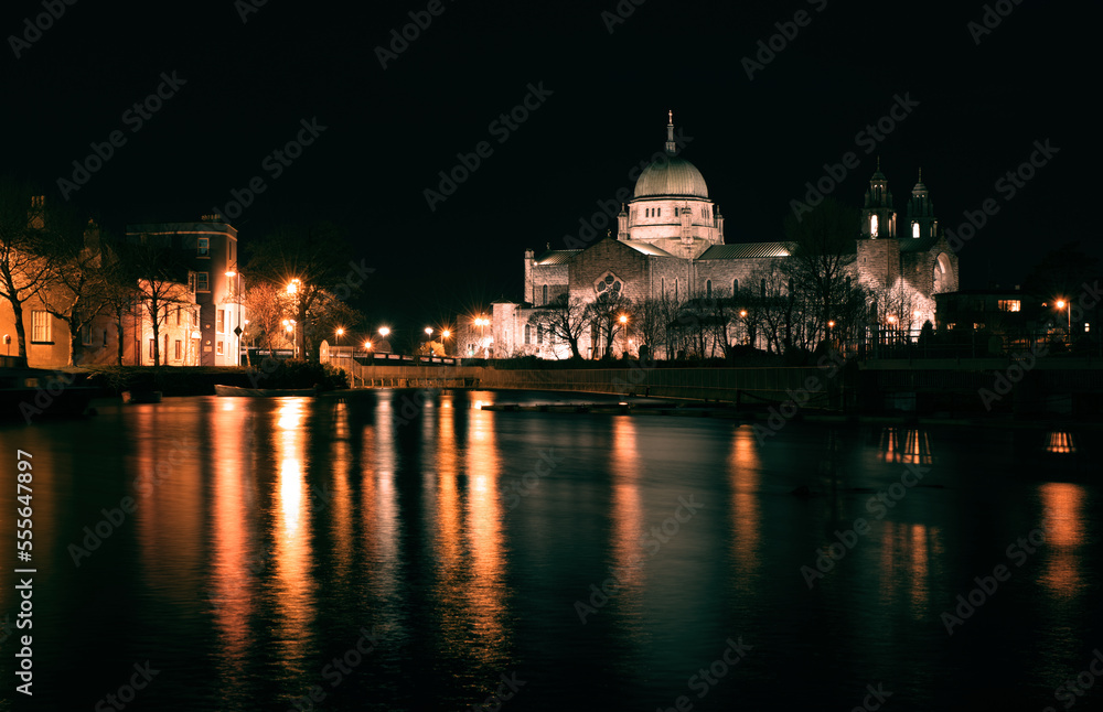 Night scene with Galway cathedral by the Corrib River in Ireland 