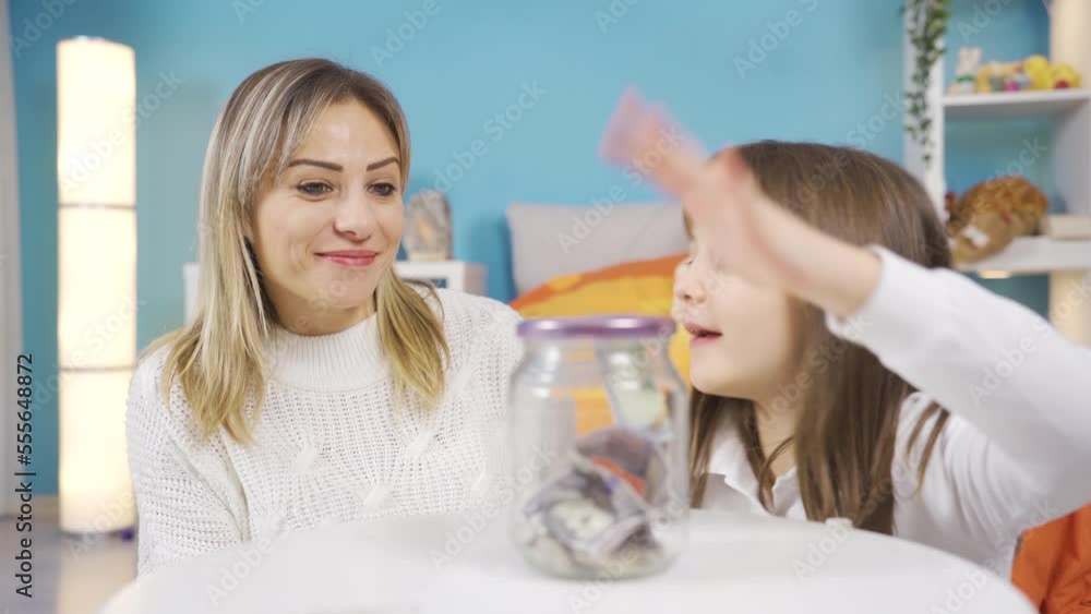Little girl saves money in piggy bank for her dreams. Frugal spending.
Little girl throwing dollars into her piggy bank is happy and learning to save money. Early investment.
Little girl saves money in piggy bank for her dreams. Frugal spending.
Little girl throwing dollars into her piggy bank is happy and learning to save money. Early investment.