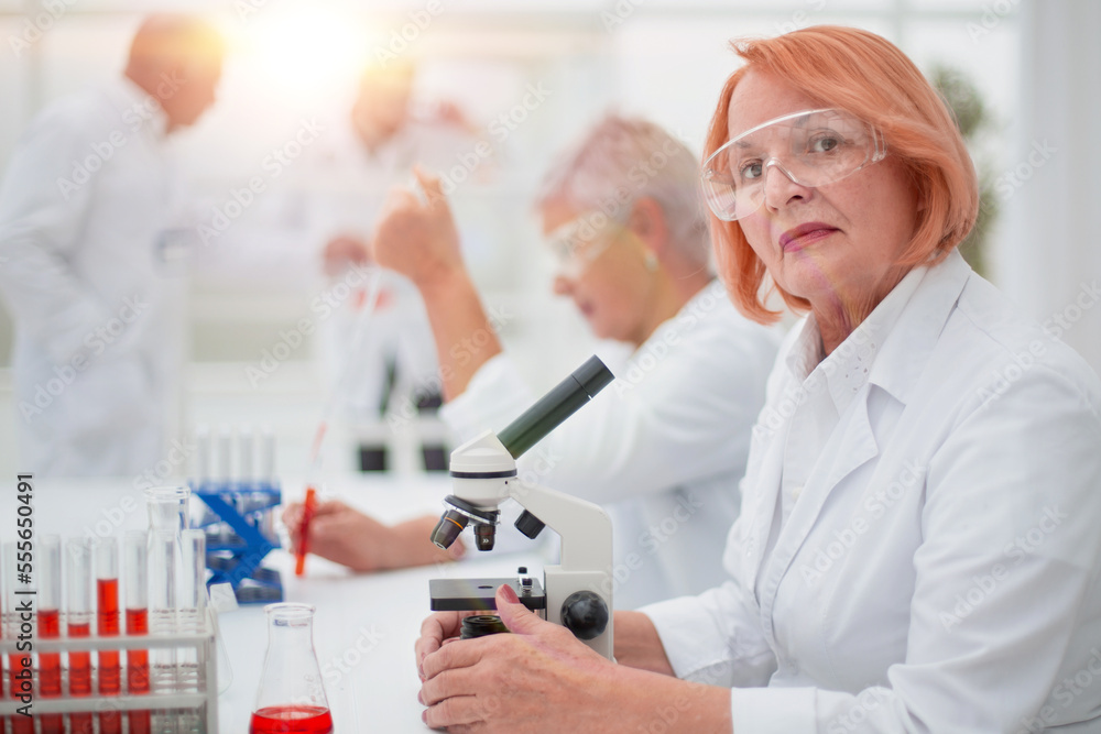 female scientist conducts a blood test in the laboratory.