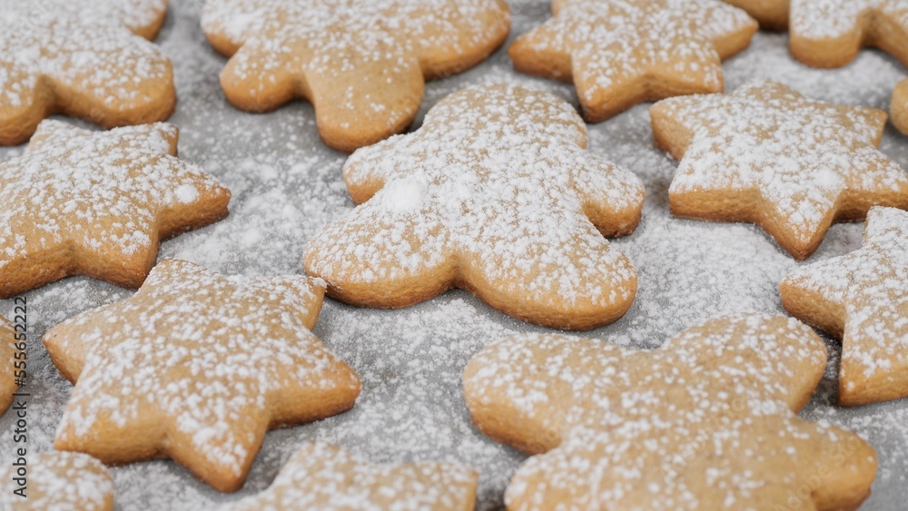 Process sprinkle powdered sugar on Christmas cookies . Traditional Christmas food