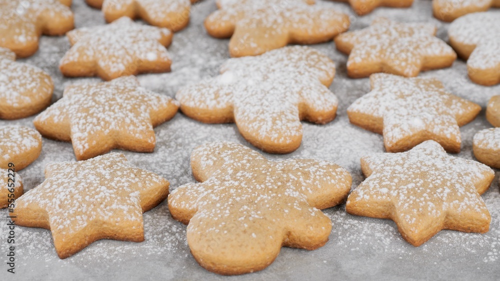 Process sprinkle powdered sugar on Christmas cookies . Traditional Christmas food