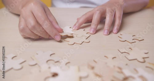 Wallpaper Mural Closeup hand of woman connecting jigsaw puzzle, Business solutions, success and strategy concept Torontodigital.ca