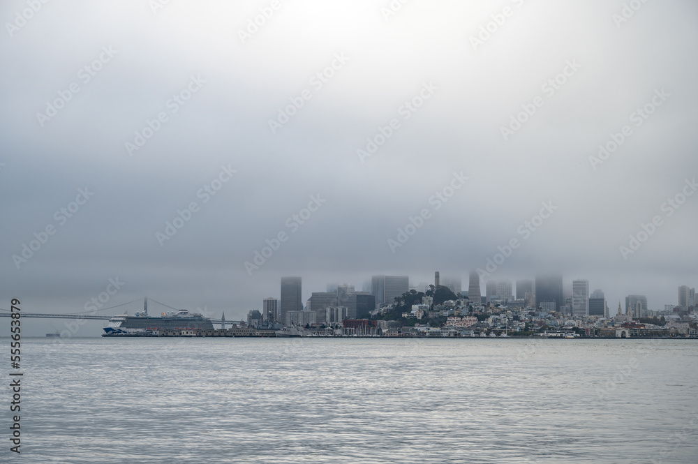 Landscape photography of the city of San Francisco with fog on a cloudy day. photography from the sea