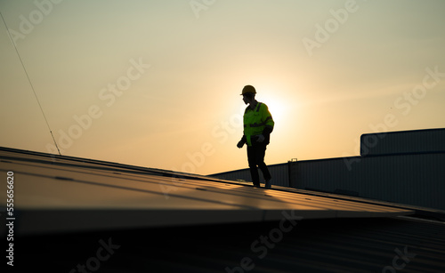 Technicians provide quarterly solar cell maintenance services on the factory roof