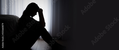 Depressed woman. Sadness and headache concept photo