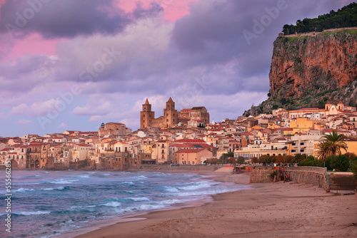 Cefalu, Sicily, Italy. Cityscape image if coastal town Cefalu in Sicily at dramatic sunset.