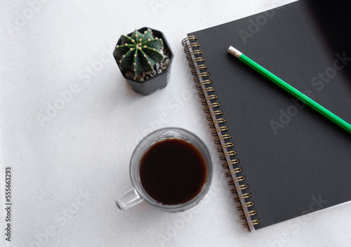 cup of coffee and notebook photo