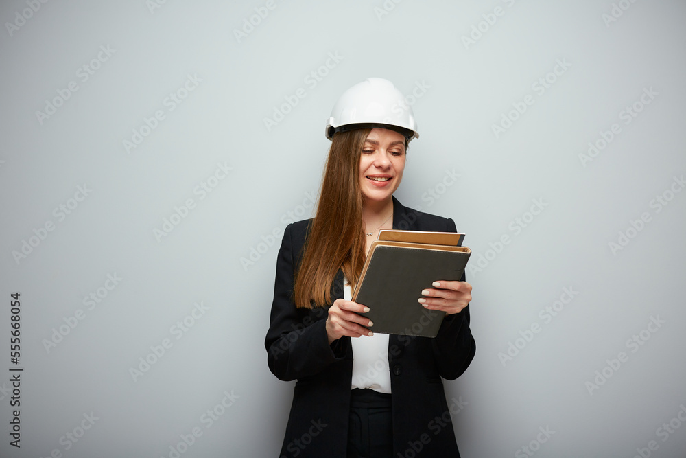 Woman student architect or engineer profession standing with book. Woman student architect or engineer profession standing with book.