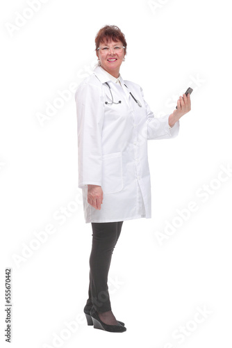 Side view of female doctor holding smartphone answering to patients over white background