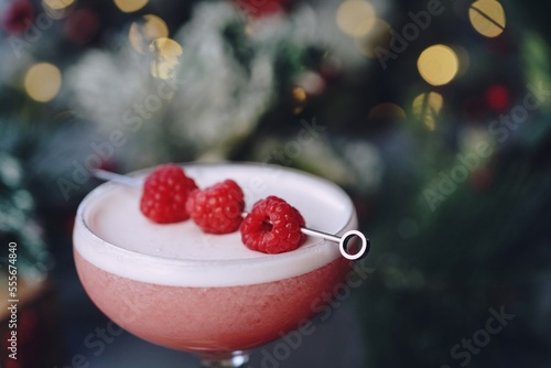 Clover club cocktail on festive holiday background, selective focus