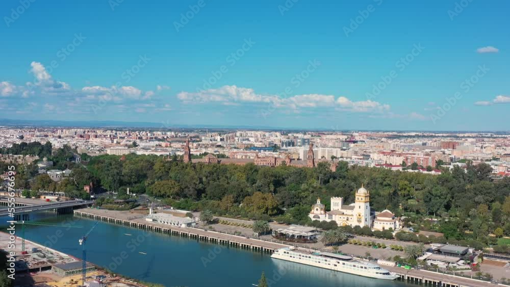 Aerial shot of an old historical European city in Seville Spain in summer on a sunny day. flight over the river Aerial shot of an old historical European city in Seville Spain in summer on a sunny day. flight over the river