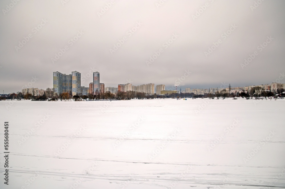 Landscape of a frozen city pond