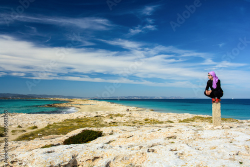 girl on vacation on the beach of Ses Illetes, Formentera photo