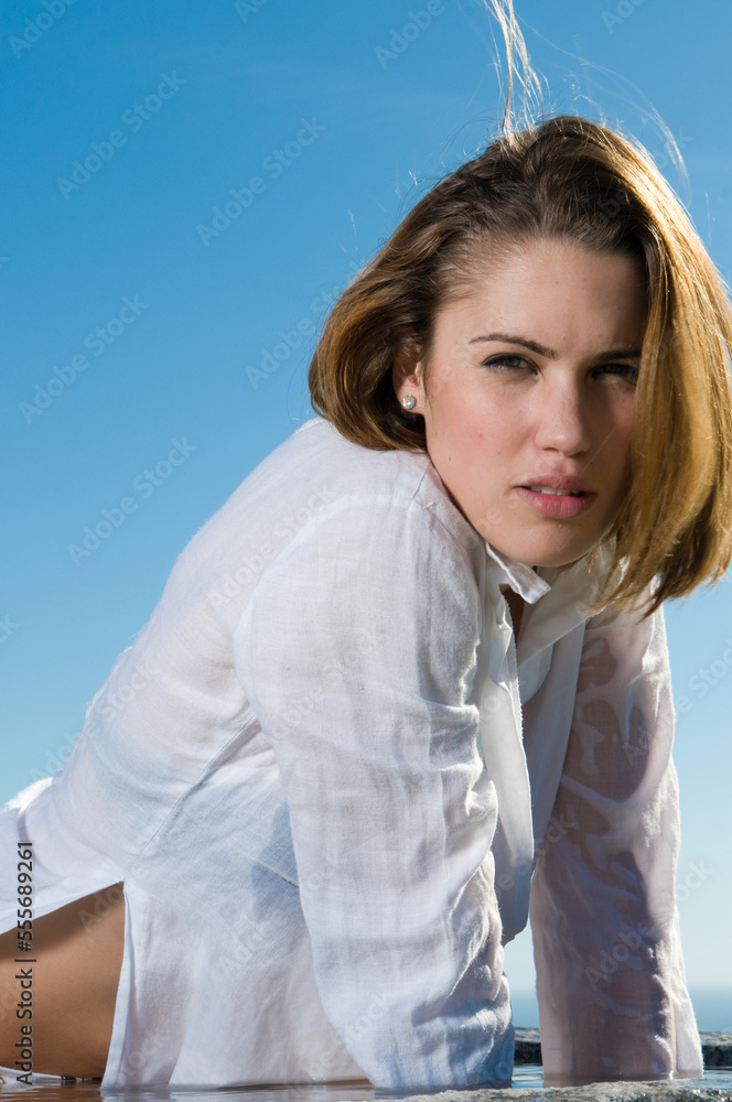 attractive woman in the sun in a seaside area in good weather attractive woman in the sun in a seaside area in good weather