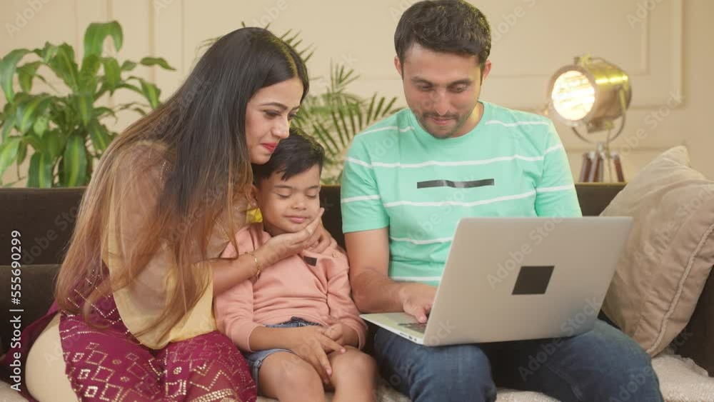 Happy smiling couple with sad kid using on laptop on sofa at home - concept of checking school admission or selection, seeing toys and ecommerce shopping. Happy smiling couple with sad kid using on laptop on sofa at home - concept of checking school admission or selection, seeing toys and ecommerce shopping.