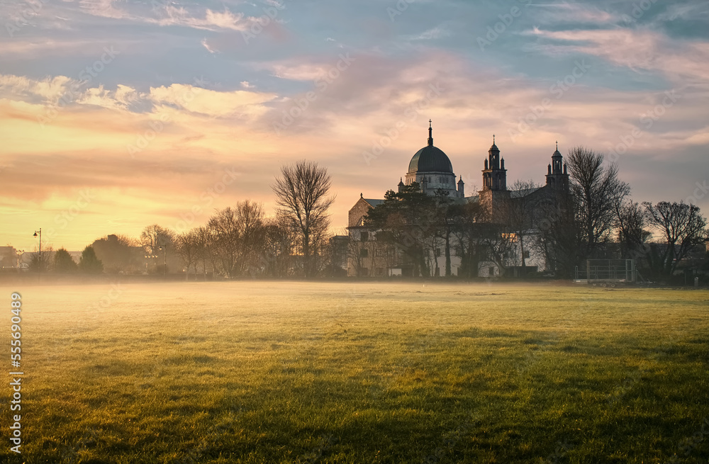 Beautiful misty sunrise scenery with Galway cathedral in Ireland 