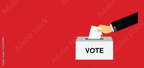 hand putting voting paper in the ballot box , election , voting ballot in a slot of box