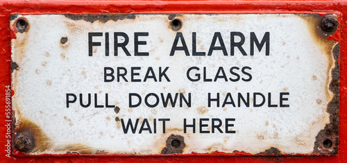 Rusty old vintage fire alarm instruction panel