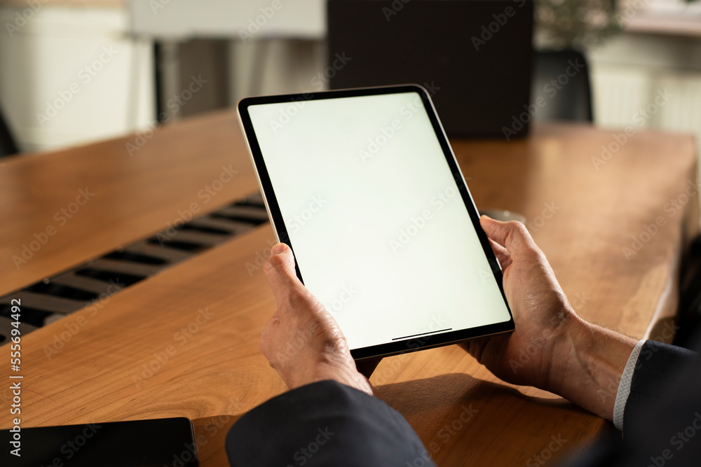 Close up of man using digital tablet. Close up of man using digital tablet.