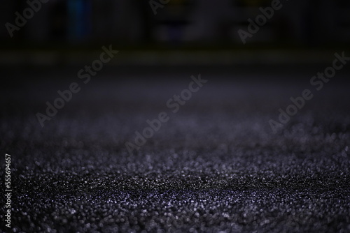 water drops on wet pavement at night