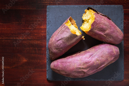 Japanese roasted sweet potato, yaki imo on wooden background