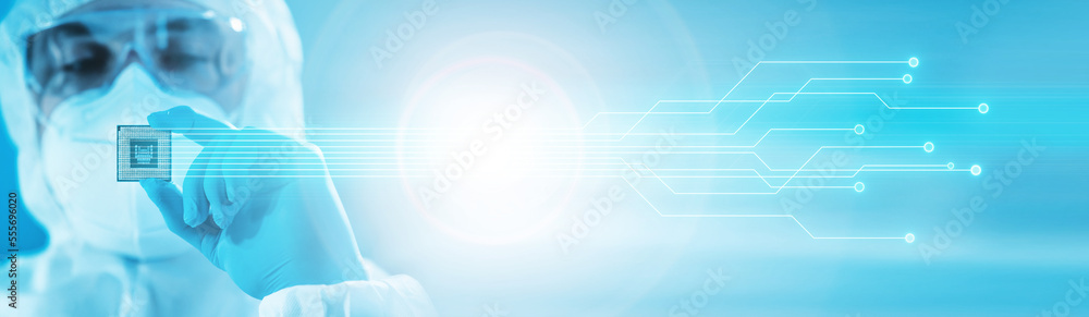 © Acronym - Close-up of Professional Scientist Holding a Modern Microprocessor Chip in Hand. Scientific Laboratory, Research and Development of Microelectronics and Processors. Computer Technology and Equipment.