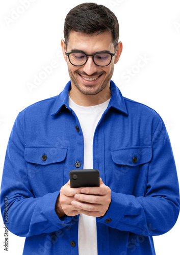 Young man in blue shirt looking at phone, surfing websites or social media, browsing