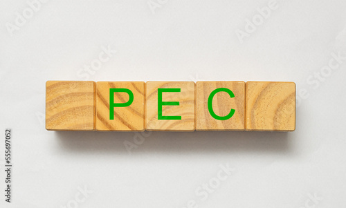 As iniciais PEC com letras verdes em cubos de madeira em língua portuguesa do Brasil as quais se referem a Proposta de Emenda à Constituição no Brasil. photo