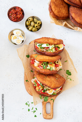 Tableau sur toile Fricasse is a savory donut  filled tuna, potato,boiled egg, olives and harissa
