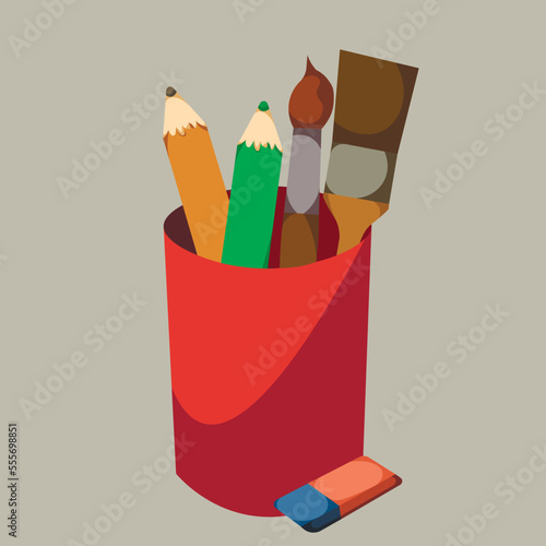 Cup with pencils, tassels and eraser